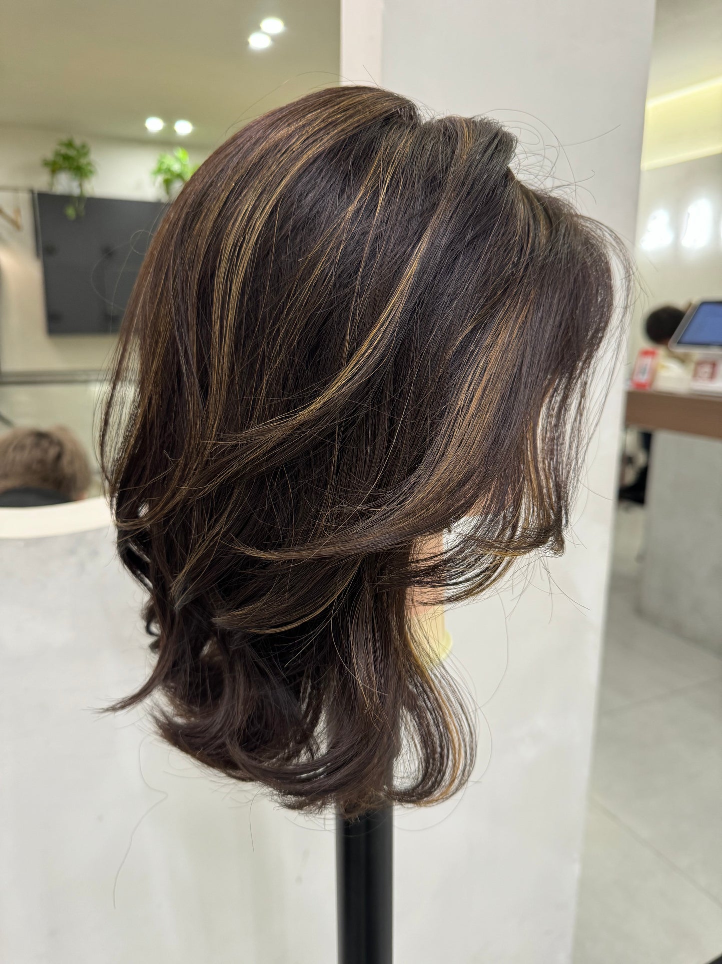 Chocolate brown balayage bob wig 14 inch side view showing caramel highlights and layered cut