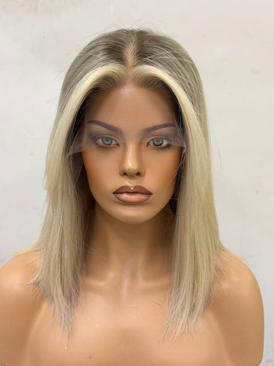 Mannequin head with a blonde wig on a white background