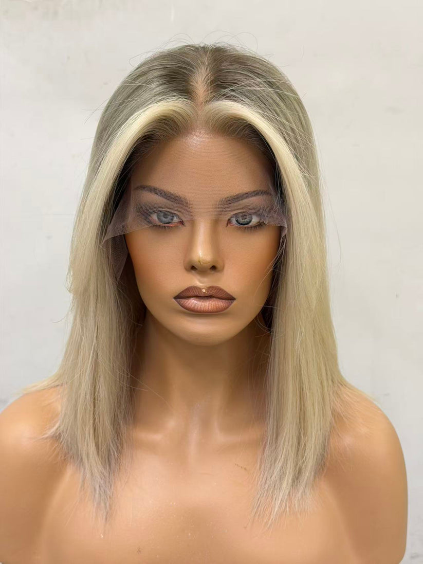Mannequin head with a blonde wig on a white background