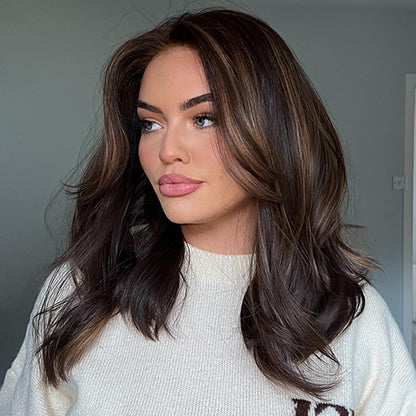 Woman in Sharon brown balayage wig white turtleneck winter style