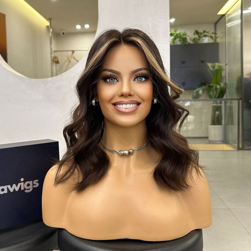 Samantha dark brown wig with caramel blonde highlights - front view on mannequin showing face-framing highlights and layered waves